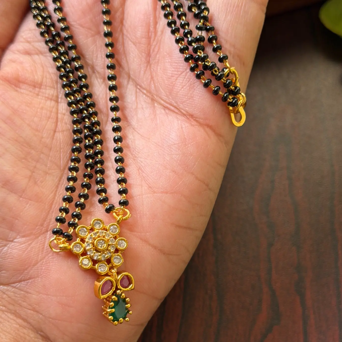 Floral CZ Floral Pendant Black Bead Mangalsutra with Ruby & Emerald Accent SJM005