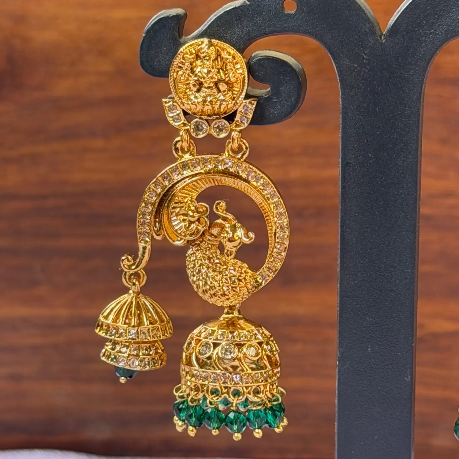 Goddess Lakshmi and Peacock Motif Gold-Plated Jhumka Earrings