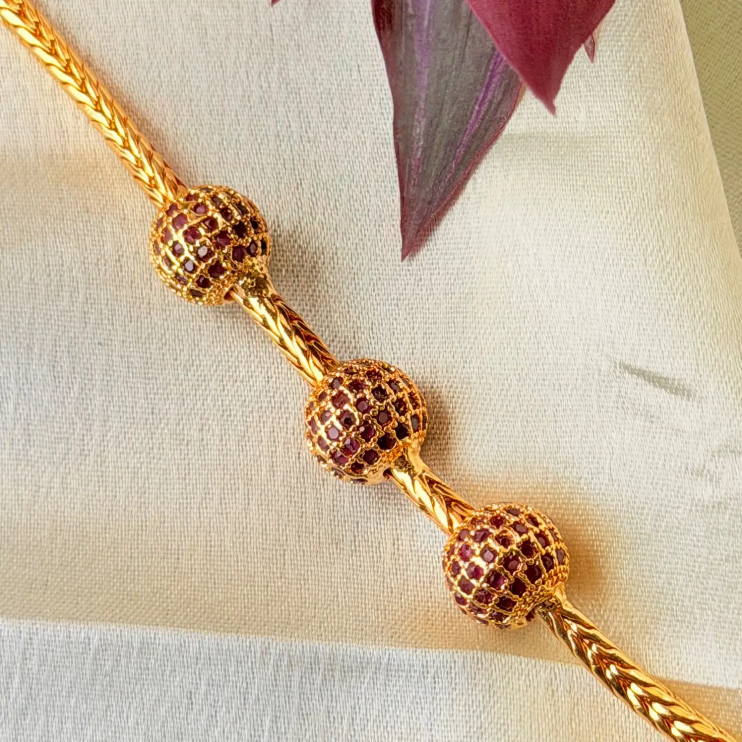 Elegant 26 Inches Gold-Plated Chain Necklace with Three Stone-Studded Spheres