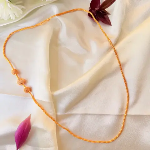 Elegant 26 Inches Gold-Plated Chain Necklace with Stone-Studded Spheres and Central Heart Charm
