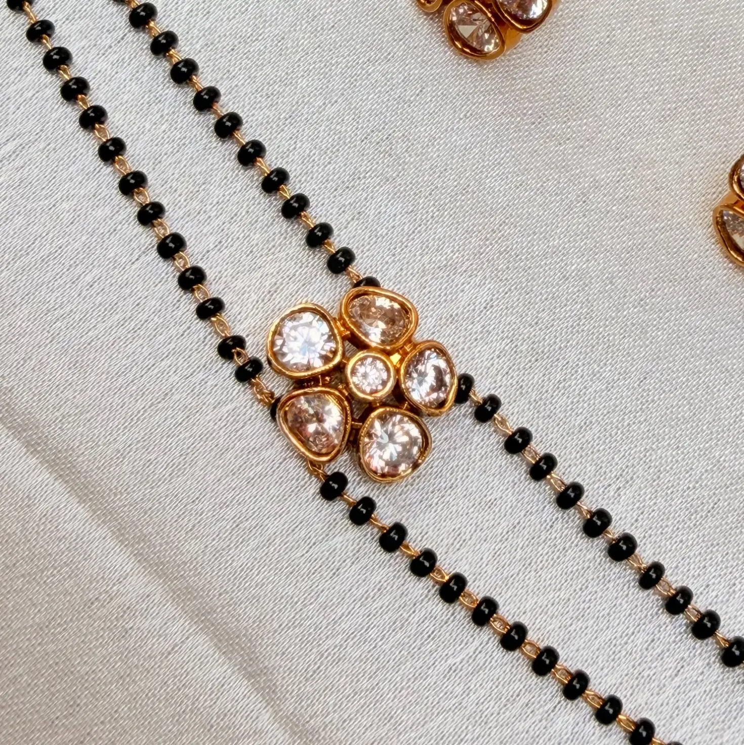 Double-Strand Black Beaded AD Stone Floral Pendant Mangalsutra Set with Earrings