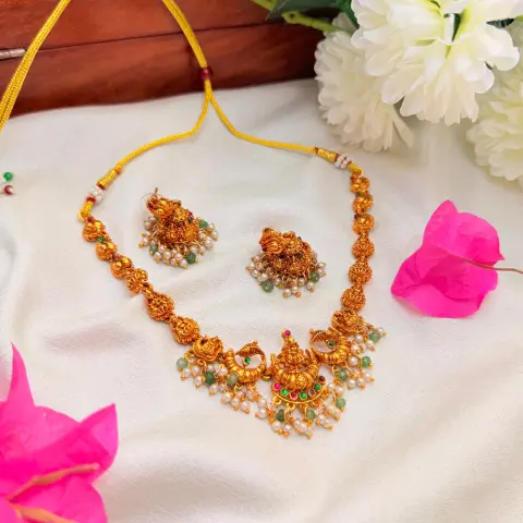 Gold Replica Antique Matte Lakshmi & Mayuri Nakshi Neckpiece with Kemp Stones, Emerald Beads & Pearl Cluster Jhumkis SJSN073