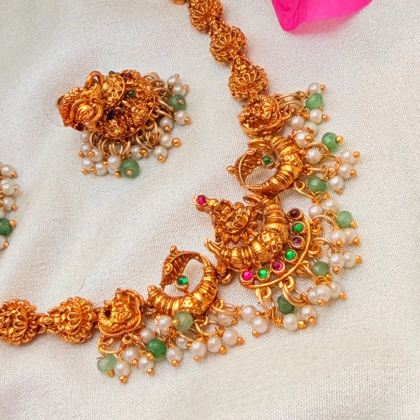 Gold Replica Antique Matte Lakshmi & Mayuri Nakshi Neckpiece with Kemp Stones, Emerald Beads & Pearl Cluster Jhumkis SJSN073