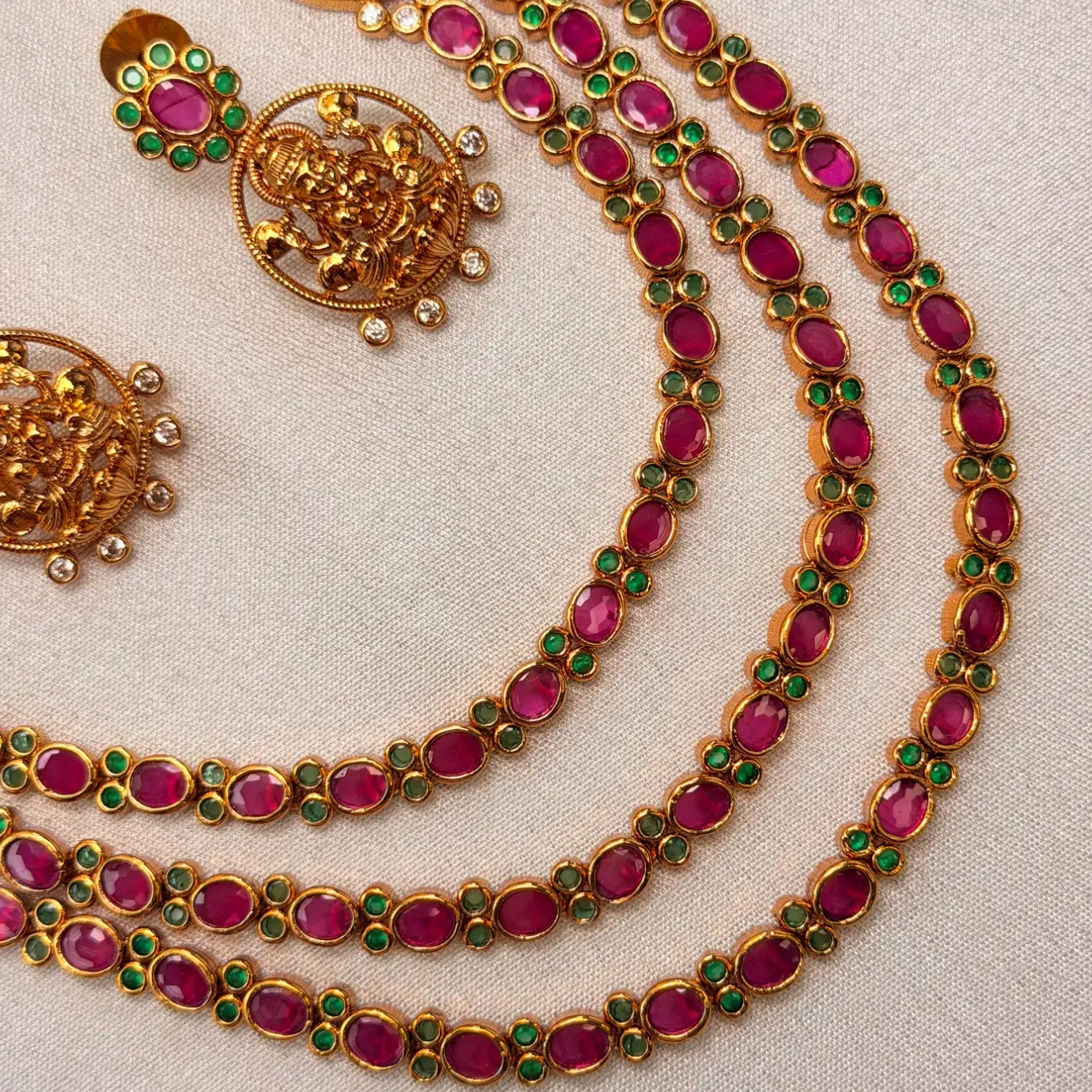 Multi-Strand Ruby Kemp & Emerald Stone Step Haram with Goddess Lakshmi Side Medallions & Matching Stud Earrings SJAD049
