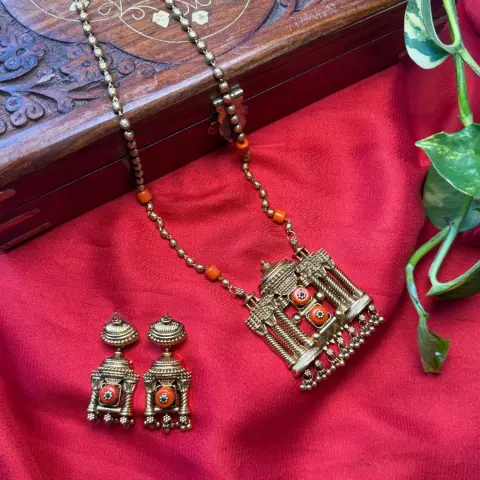 Temple Architecture Mandap Neckpiece with Coral and Polki Diamond Simulant Settings, Beaded Long Chain, and Matching Jhumka Earrings