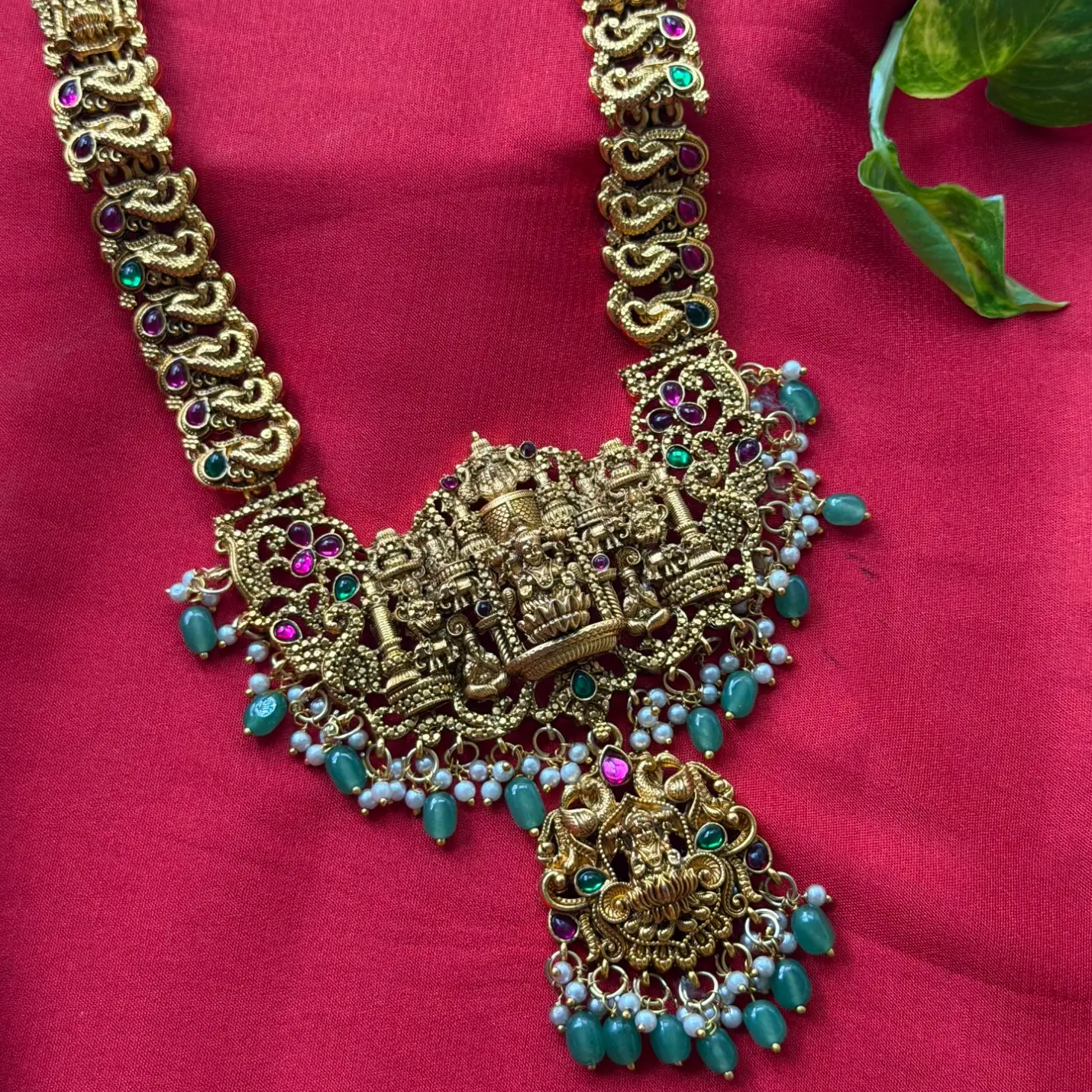 Temple Nakshi Long Haram Set – Seated Goddess Lakshmi & Govinda Shrine Pendant, Green Bead Drops & Matching Jhumka Earrings
