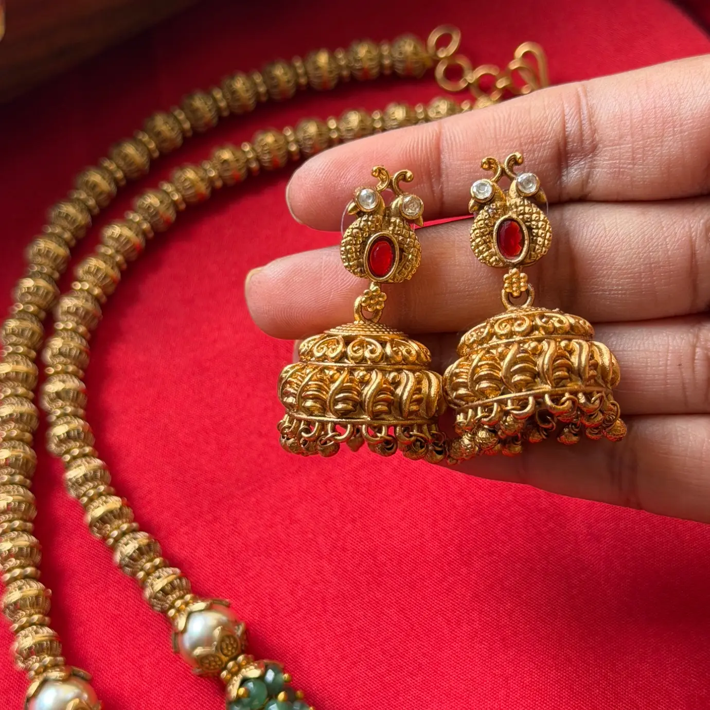 Gold Replica Antique Ruby Oval Solitaire Filigree Pendant Necklace Set – Beaded Mala Chain with Emerald & Pearl Accents, and Matching Temple Jhumkas