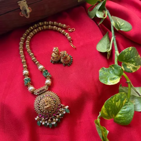 Goddess Lakshmi Circular Medallion Pendant Long Necklace Set – Fluted Bead Mala, Emerald-Ruby Kemp Accents, Mint Green Beads & Matching Jhumkas