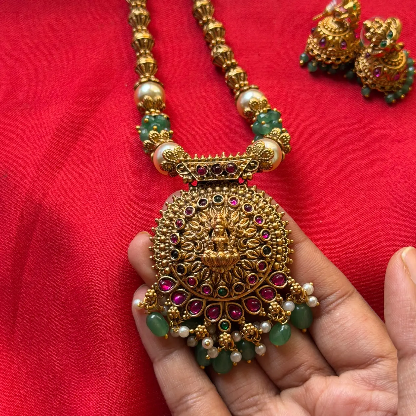 Goddess Lakshmi Circular Medallion Pendant Long Necklace Set – Fluted Bead Mala, Emerald-Ruby Kemp Accents, Mint Green Beads & Matching Jhumkas