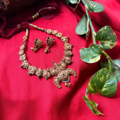 Gold Replica Antique Crescent Temple Nakshi Necklace Set – Flying Peacock Motifs, Ruby-Emerald Kemp Accents & Matching Earrings