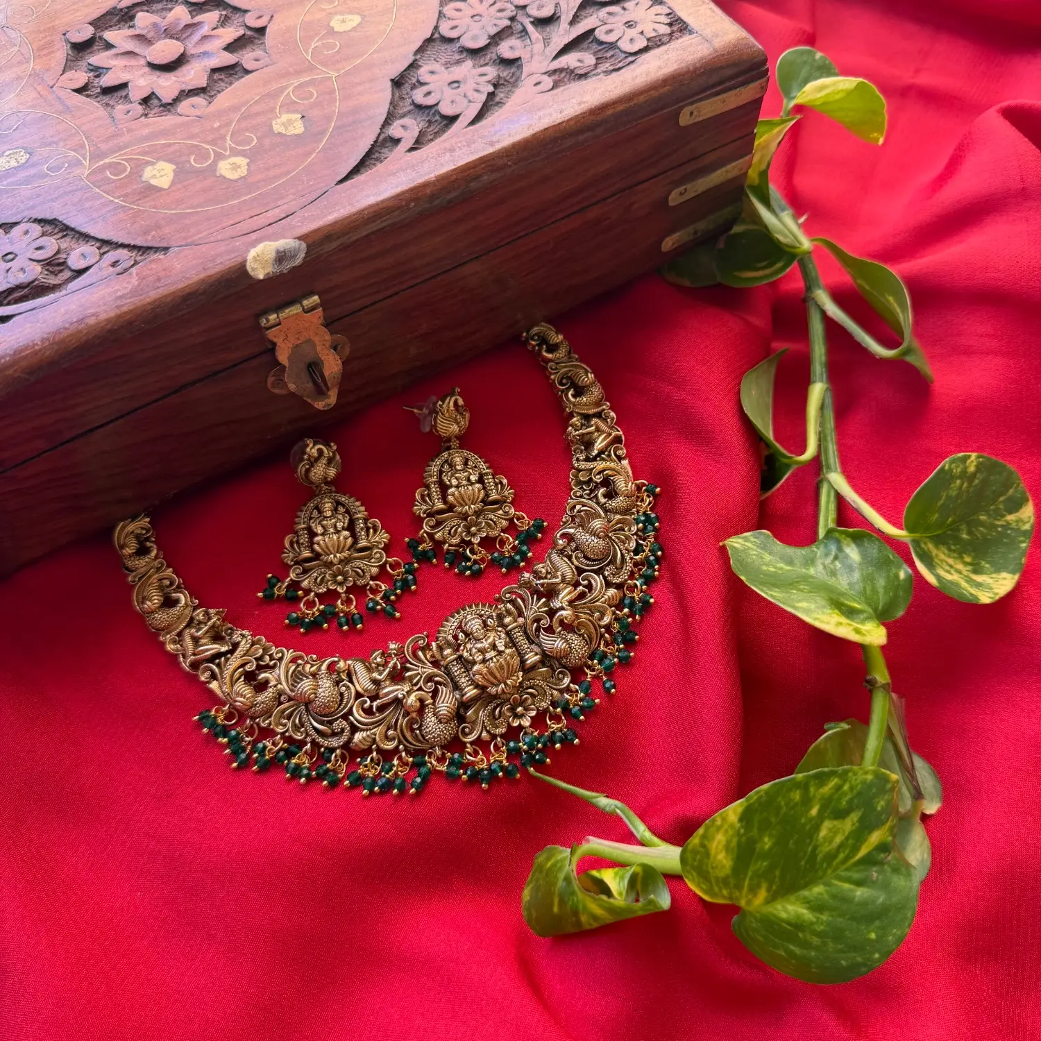Gold Replica Antique Temple Nakshi Seated Goddess Lakshmi & Dancing Peacock Choker Set – Emerald Green Bead Clusters & Matching Shrine Earrings