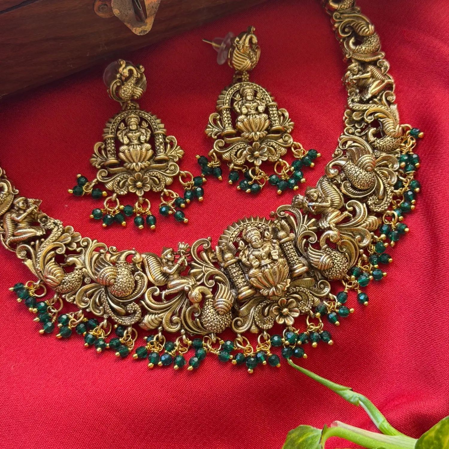 Gold Replica Antique Temple Nakshi Seated Goddess Lakshmi & Dancing Peacock Choker Set – Emerald Green Bead Clusters & Matching Shrine Earrings