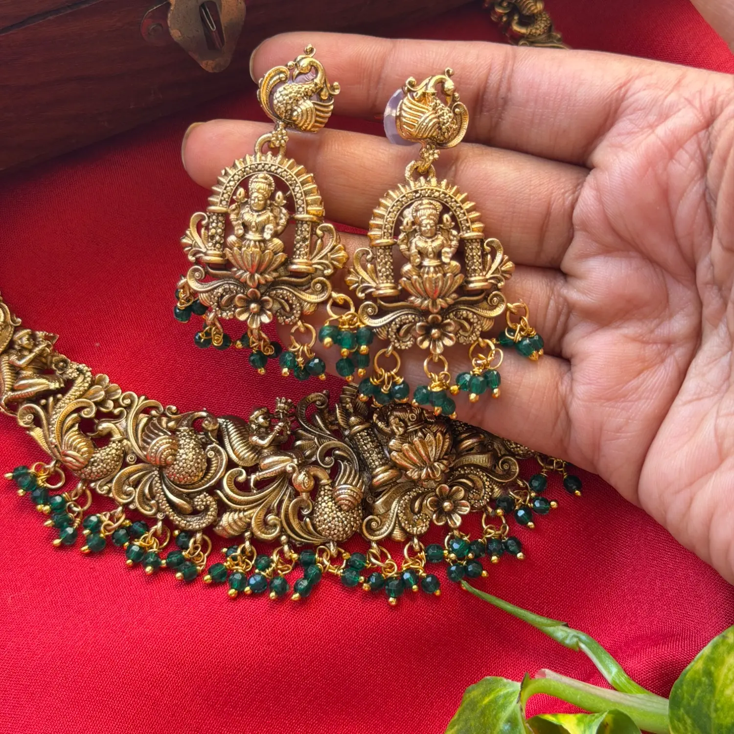 Gold Replica Antique Temple Nakshi Seated Goddess Lakshmi & Dancing Peacock Choker Set – Emerald Green Bead Clusters & Matching Shrine Earrings